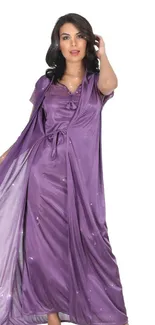 A woman in an elegant purple nightgown set against a plain backdrop.