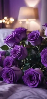 Purple roses arranged in a cozy bedroom setting.