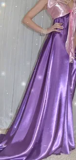 Elegant purple satin dress displayed with shimmering effect.