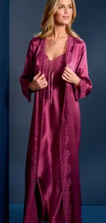 Woman in elegant purple satin robe against dark background.