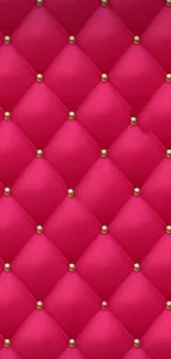 Luxurious fuchsia quilted wallpaper with gold accents and diamond pattern.