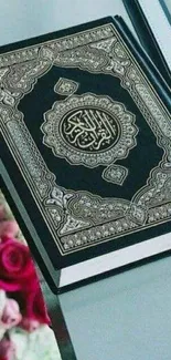 Stylish Quran with roses on a table, creating a serene mobile wallpaper.