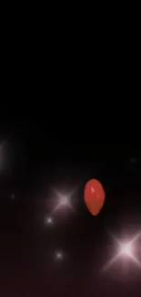 Red balloon with glowing stars on black background.