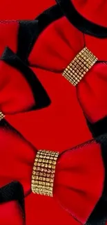 Elegant red bow ties with golden accents on a red background wallpaper.