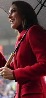 Woman in red coat with umbrella, stylish portrait.