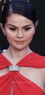 Portrait of person wearing elegant red dress with silver embellishment.