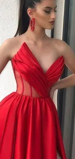 Elegant woman in red dress with stylish design.