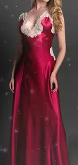 Woman in elegant red gown with lace details on a starry background.