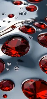 Red gemstones on a reflective dark metal surface.