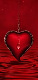 Striking red heart with chain on water backdrop.