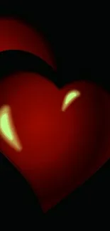 Elegant red heart on a dark background with a glow effect.