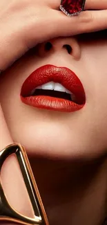 Close-up of red lips with gold and ruby jewelry.