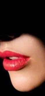 Close-up of elegant red lips with black background wallpaper.