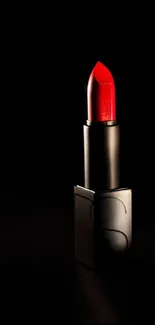 Elegant red lipstick on a black background wallpaper.