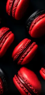 Red and black macarons on a dark background