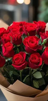 A bouquet of vibrant red roses wrapped elegantly.