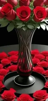 Elegant arrangement of red roses in a black vase.