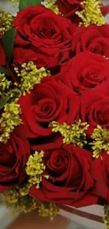 A vibrant bouquet of red roses and yellow flowers.