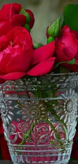 Elegant red roses in a decorative vase.