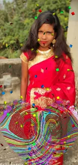 Woman in vibrant red saree with a serene outdoor background.