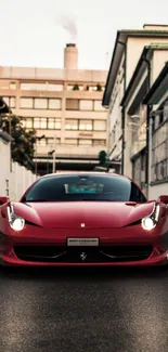 Front view of a sleek red sports car parked in an urban alleyway.