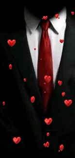 A black suit with a striking red tie on a dark background.