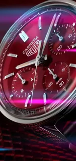 Close-up of a luxurious red wristwatch on a textured background.