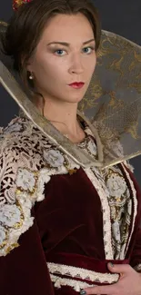 Portrait of person in regal attire with maroon and gold embroidery.