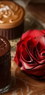 Close-up of a red rose beside a chocolate dessert.
