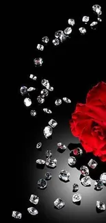 Red rose and sparkling diamonds on a black background wallpaper.