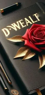 Luxurious black diary with a red rose and golden leaves.