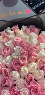 Bouquet of pink and white roses in elegant arrangement.