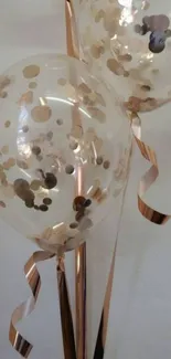 Rose gold balloons with confetti design.