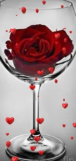 Mobile wallpaper with a red rose in a glass, offering elegance and beauty.