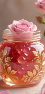 A beautiful pink rose sitting in an ornate glass jar with gold leaf design.
