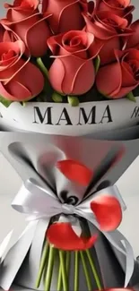 Bouquet of red roses wrapped in silver paper with floral decor.