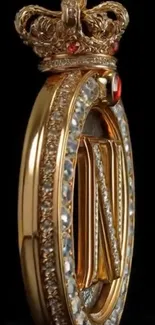 Golden royal crown pendant with jewel accents on a dark background.