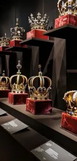 A display of royal crowns on velvet in a museum setting.