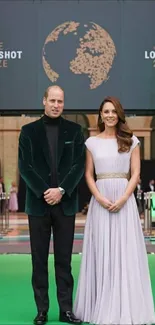 Royal event wallpaper with green theme and elegant attire.