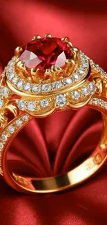 Golden ring with ruby on red fabric background.