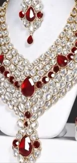 Luxurious ruby and pearl jewelry set on display.