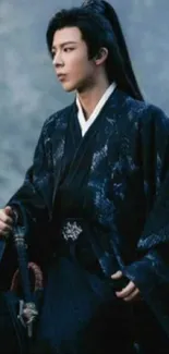 Samurai in blue robe, holding a sword, exuding elegance.