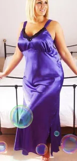 Woman in luxurious purple satin dress in a stylish bedroom.