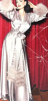 Elegant women in silver and burgundy satin gowns with rich textures.