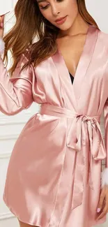 Elegant pink satin robe with white fluffy trim.