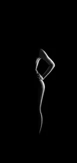 Elegant silhouette of a human form on black background.