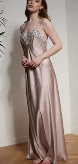 Woman in a chic silk evening dress standing elegantly.