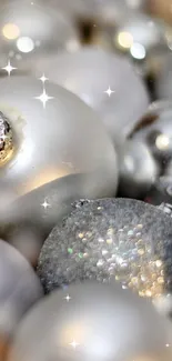 Elegant silver Christmas ornaments with glittering snowflakes.