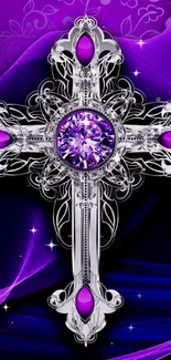 Silver cross with purple gemstone on artistic background.