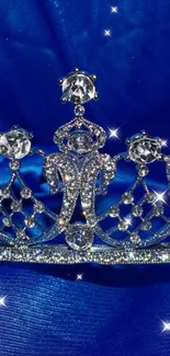 Silver crown with jewels on a royal blue background